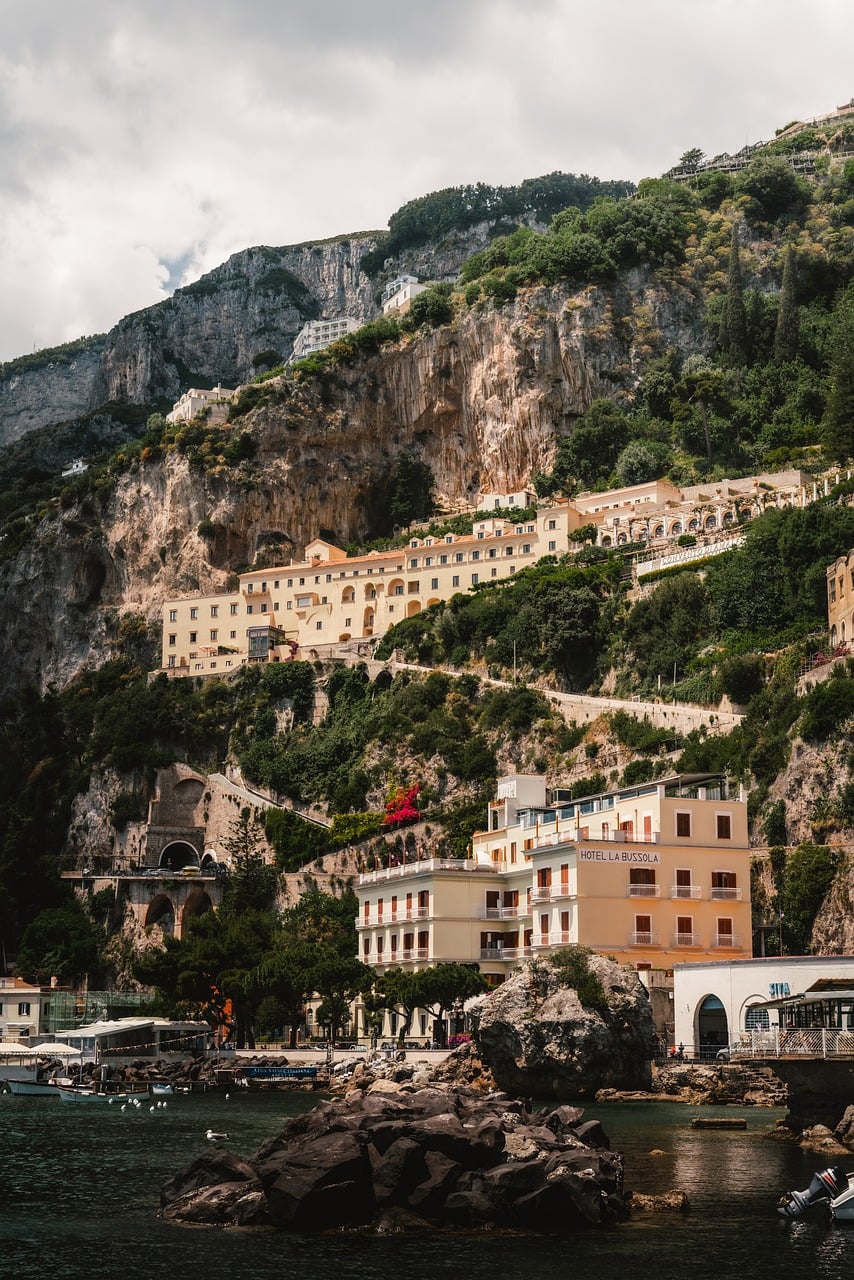 amalfi, coastal town, italian architecture, mediterranean, colorful houses, tourist destination, rocky cliff, italy vacation, scenic beauty, vacation spot, photogenic, cobbled streets, italy, tourist footprints, hilly hills, fall, relaxation, marine vibe,