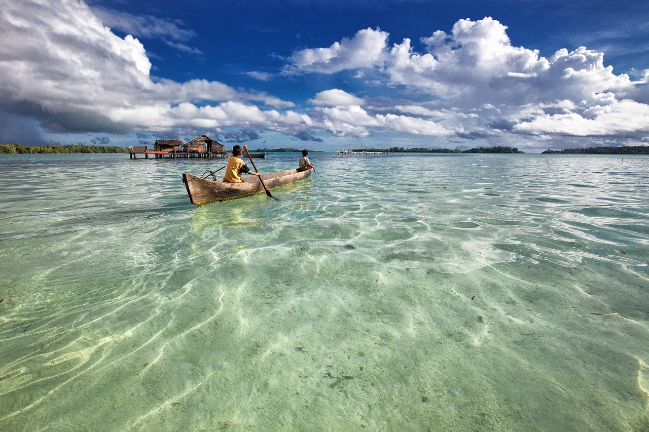 lagoon, dugout canoe, paddling, canoe, water, ocean, sea, atoll, widi islands, halmahera, indonesia, row, rowing, nature, beach, clear water