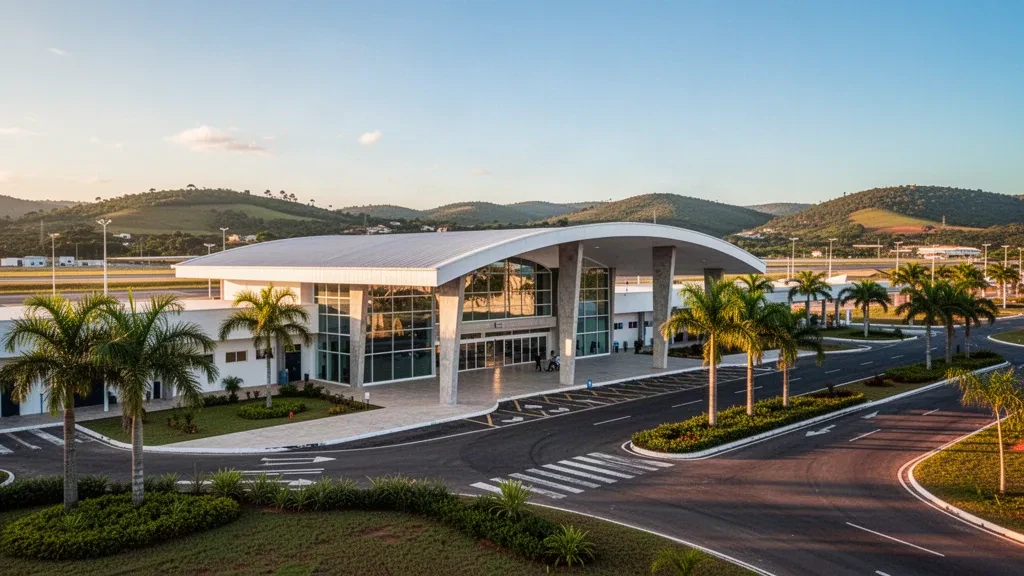 Modern passenger terminal and drop-off lane at Caruaru Airport in Pernambuco, Brazil, with tropical landscaping and golden-hour light