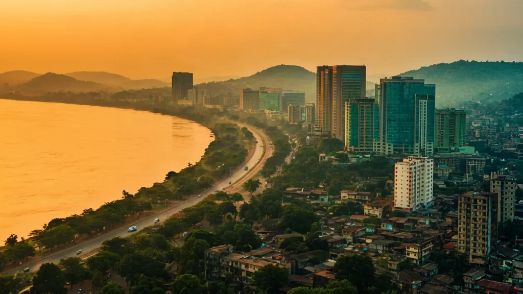 Golden-hour aerial view of the Kinshasa skyline along the Congo River in the Democratic Republic of Congo