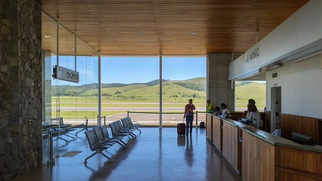 Interior of Diamantina Airport DTI terminal in Minas Gerais, Brazil, with departure hall seating and runway views.